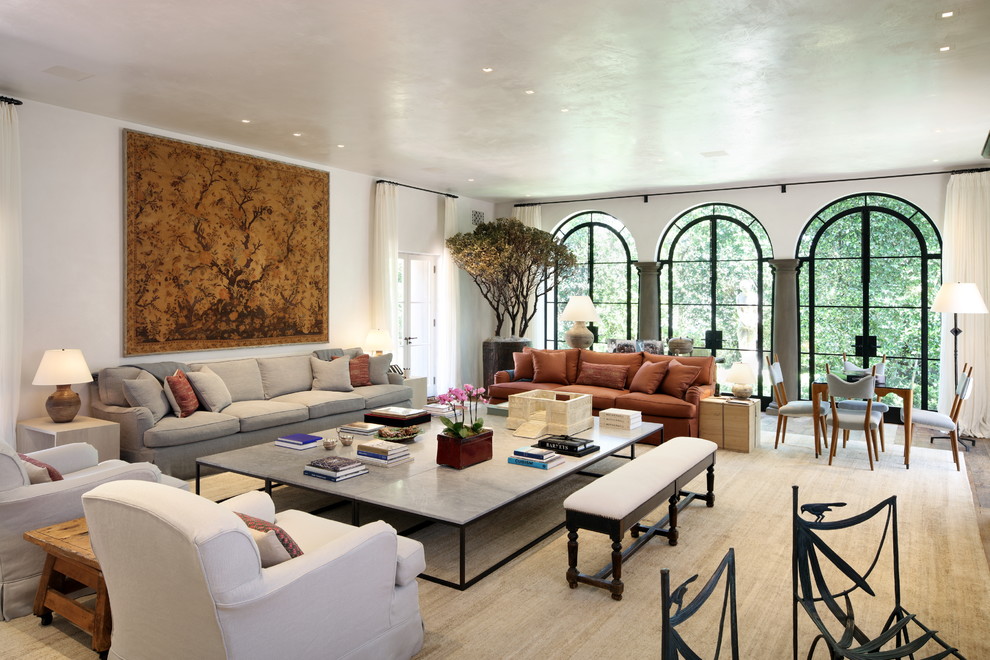 This is an example of a mediterranean formal living room in Los Angeles with white walls.