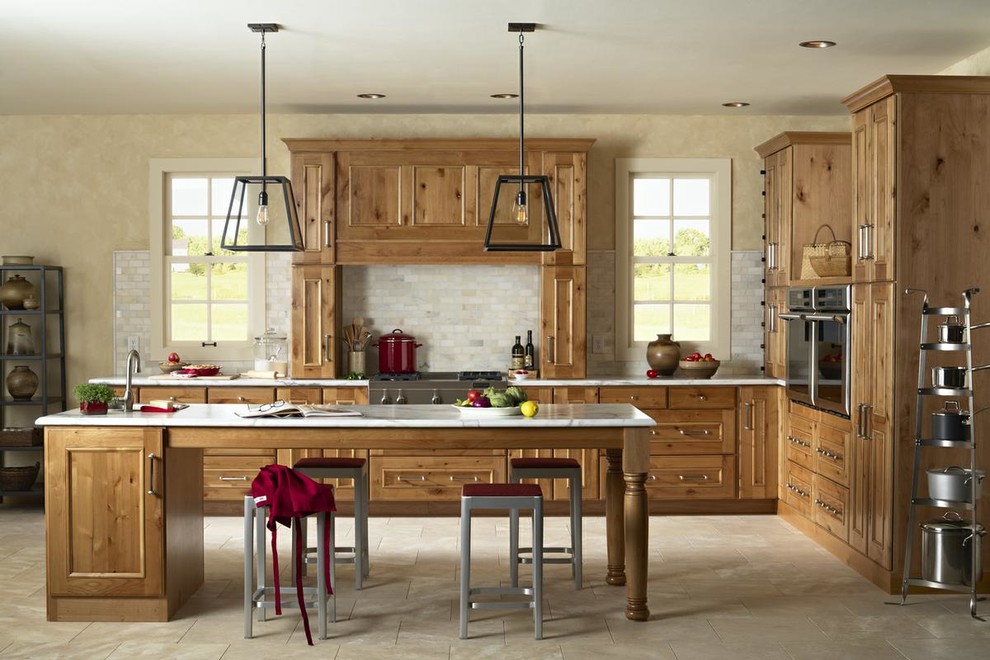 Example of a mid-sized mountain style l-shaped ceramic tile and beige floor eat-in kitchen design in Orange County with recessed-panel cabinets, medium tone wood cabinets, marble countertops, gray backsplash, marble backsplash, stainless steel appliances and an island
