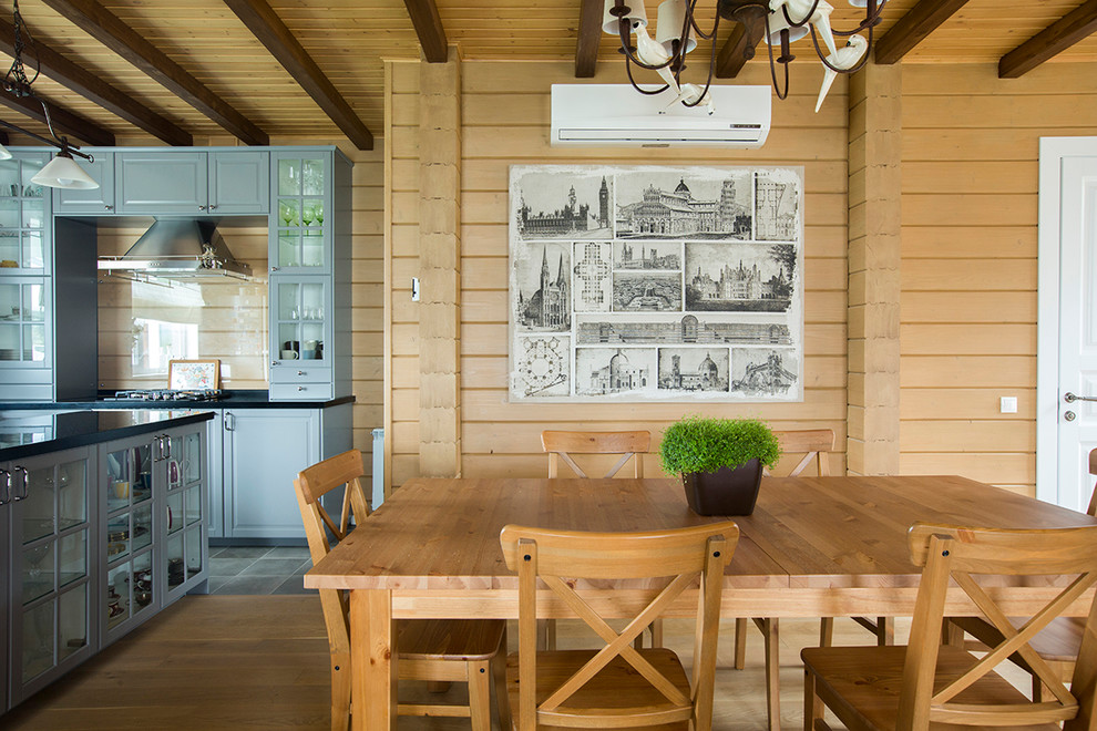 Country dining room in Moscow with brown walls.