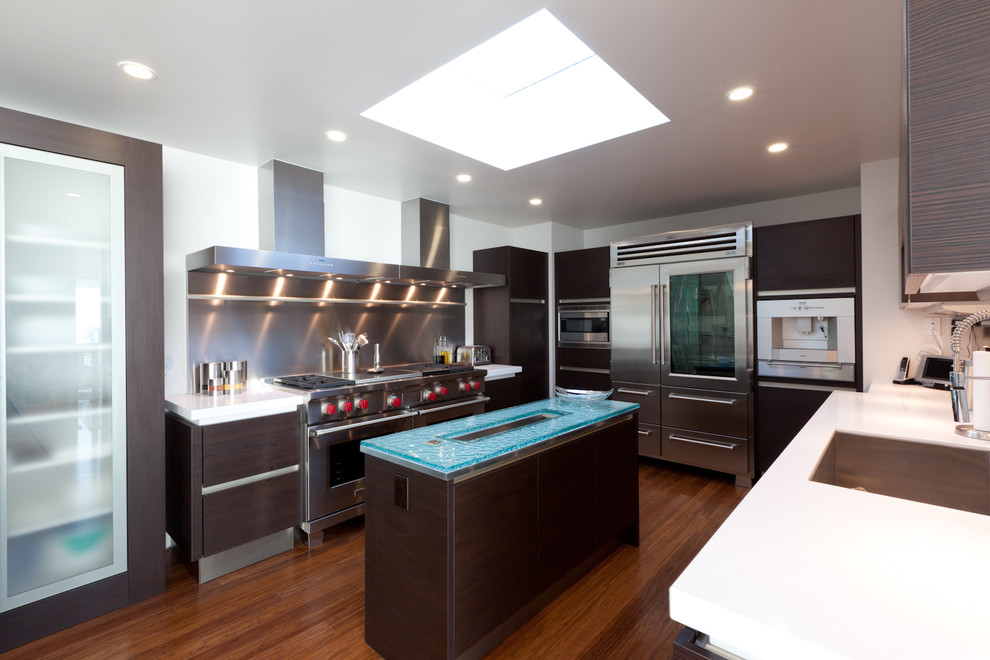 This is an example of a contemporary kitchen in San Luis Obispo with glass benchtops and turquoise benchtop.