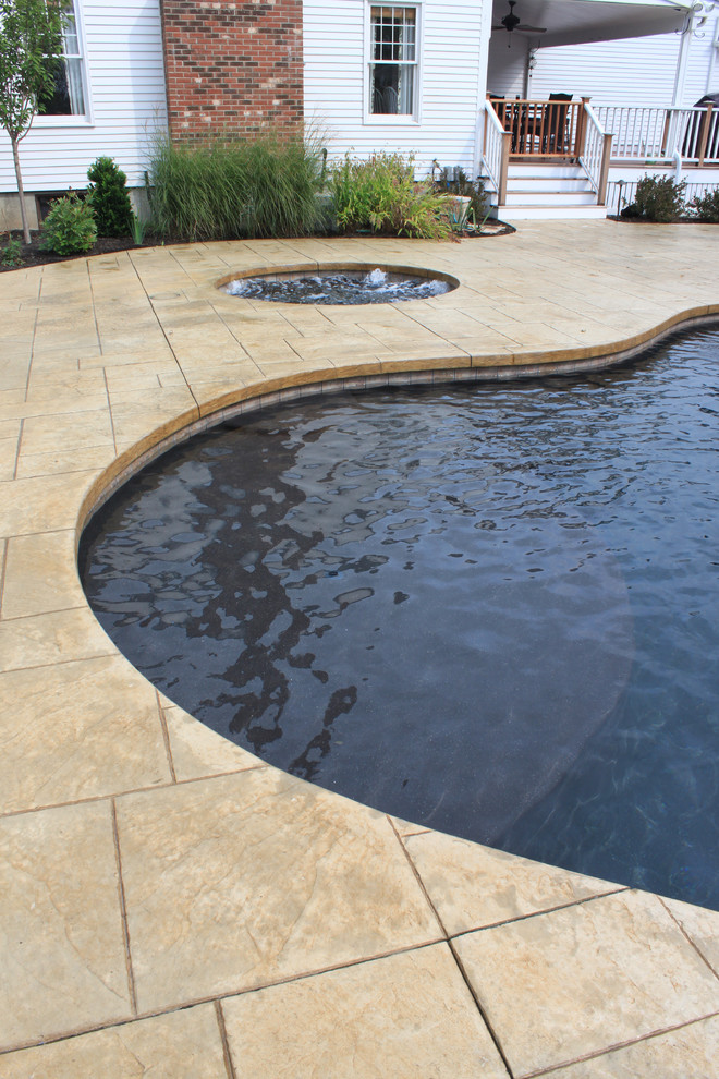 Inspiration for a rustic pool remodel in Boston