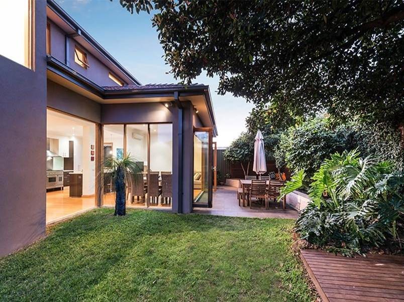 Inspiration for a mid-sized modern two-storey brick grey exterior in Melbourne with a hip roof.
