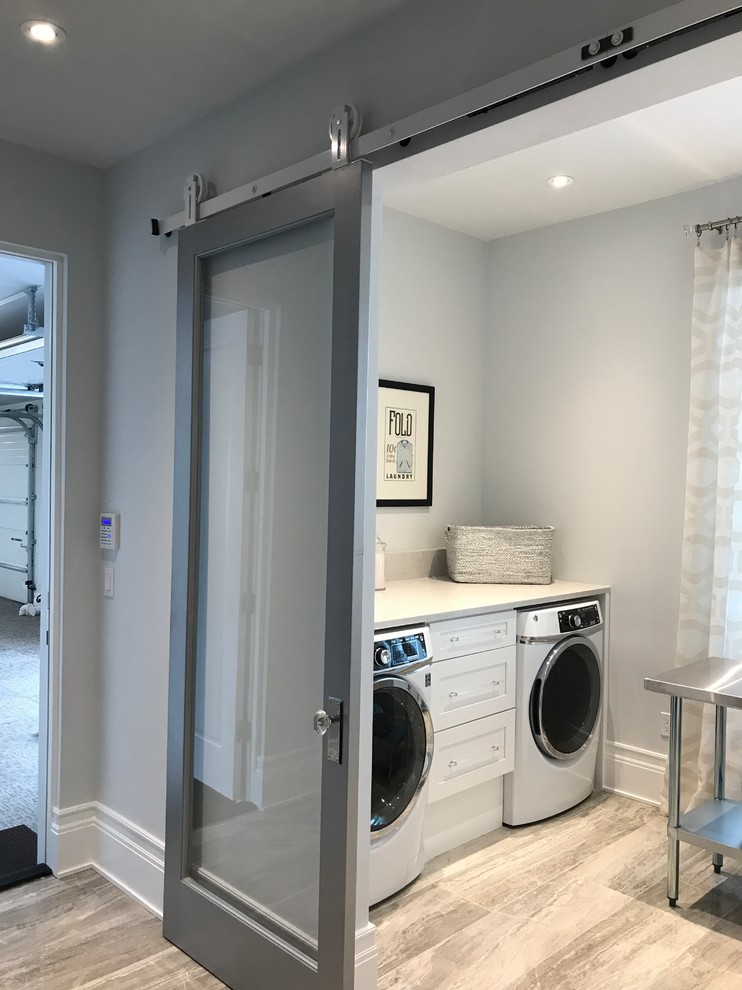 This is an example of a transitional laundry room in Orlando.
