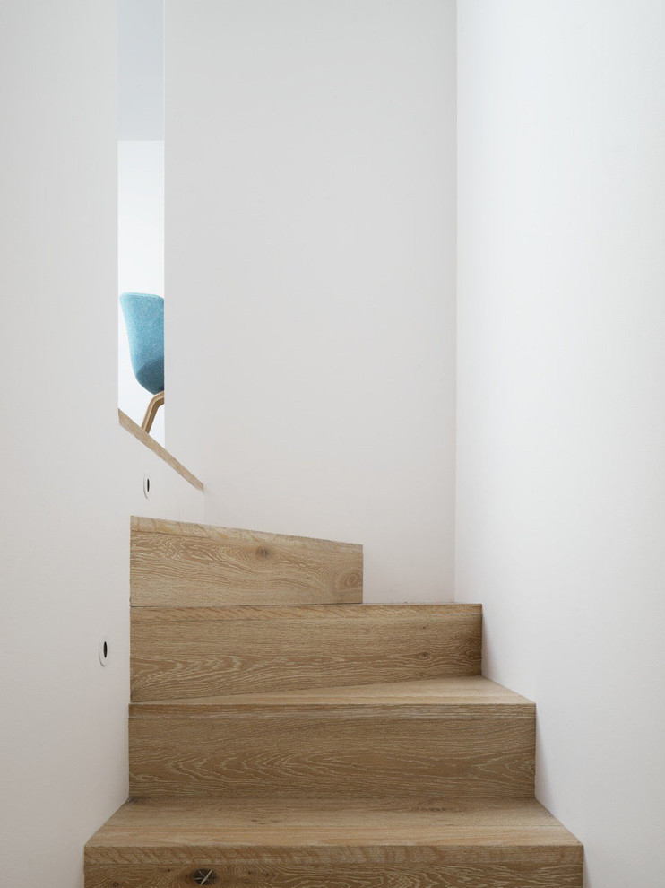 Photo of a small contemporary wood l-shaped staircase in Sydney with wood risers.