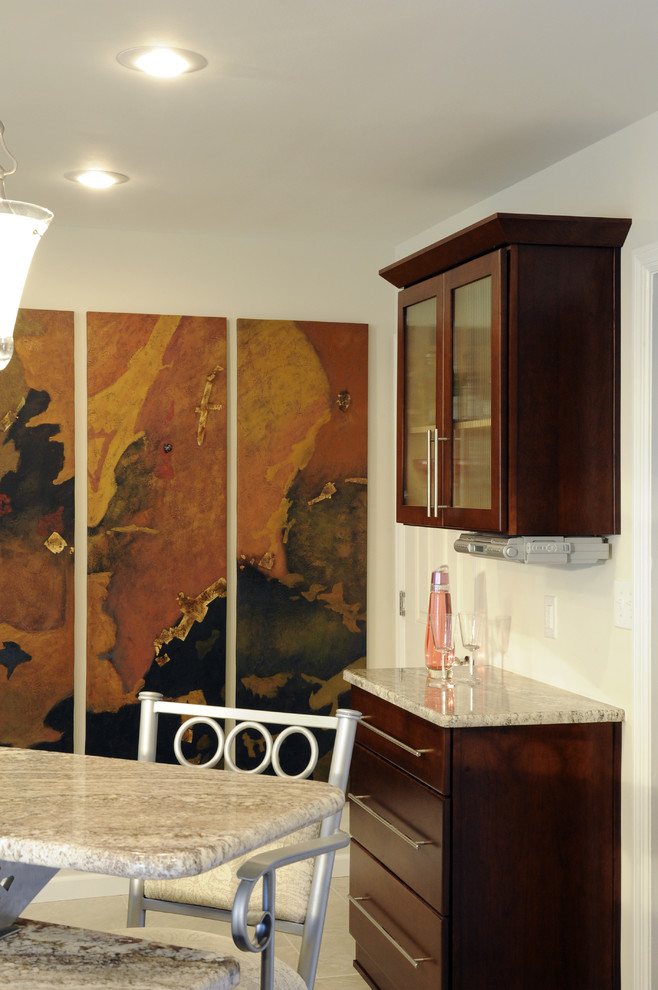Example of a large transitional u-shaped ceramic tile and beige floor eat-in kitchen design with a double-bowl sink, shaker cabinets, dark wood cabinets, granite countertops, beige backsplash, mosaic tile backsplash, stainless steel appliances and a peninsula