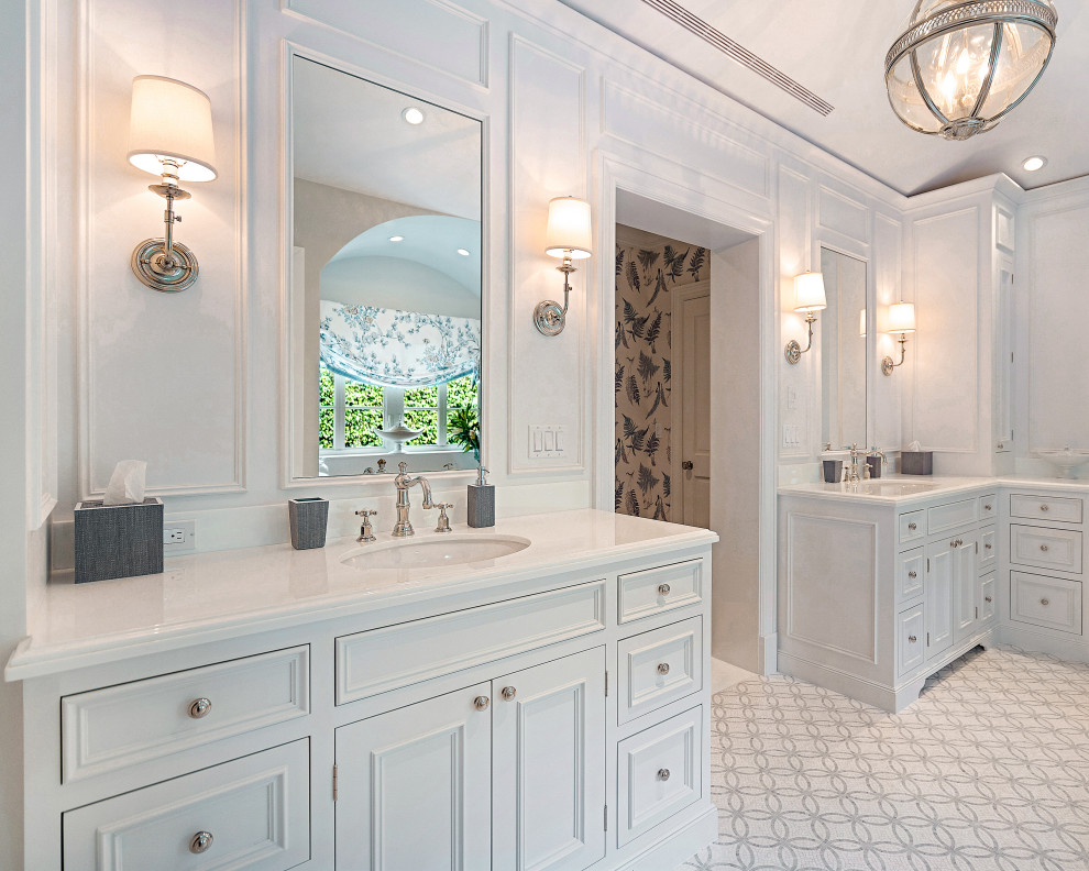 Design ideas for an expansive beach style master bathroom in Miami with recessed-panel cabinets, white cabinets, white walls, an integrated sink, grey floor, white benchtops, a double vanity, a built-in vanity and panelled walls.