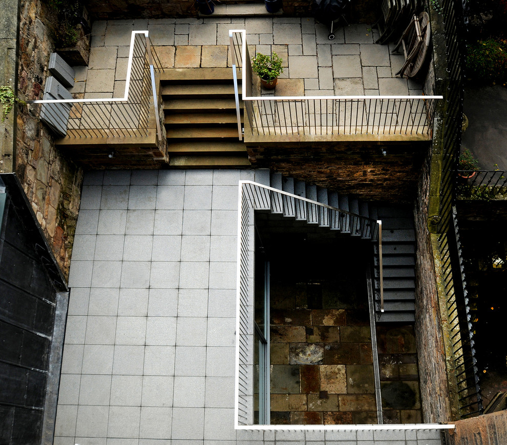 This is an example of a mid-sized transitional patio in Edinburgh.