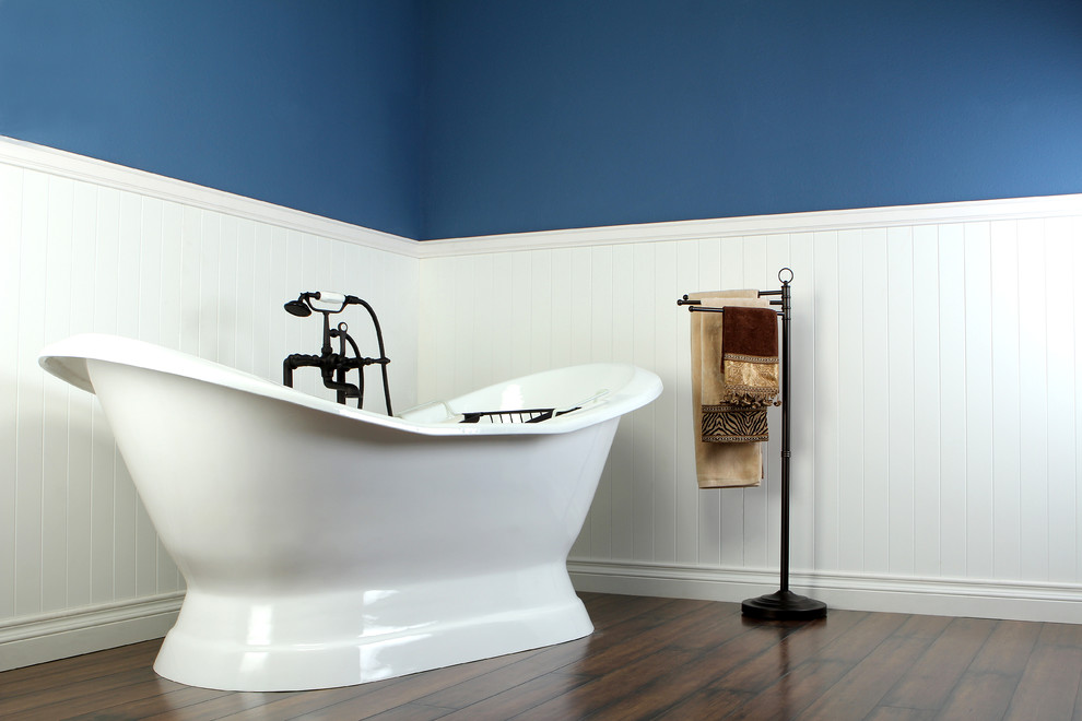 This is an example of a traditional bathroom in Los Angeles with a freestanding tub and an open shower.