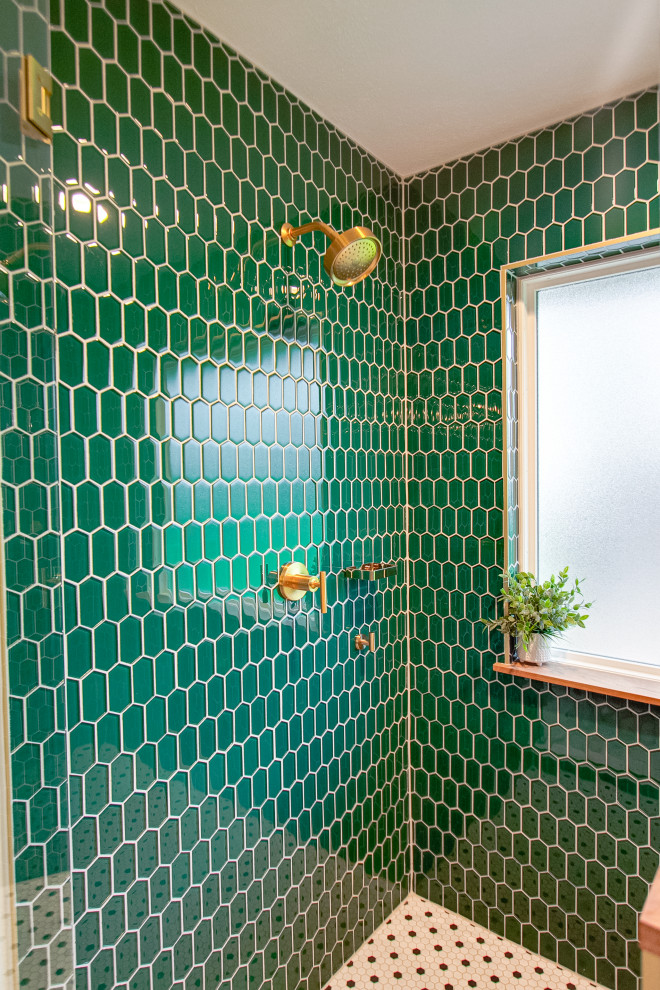 This is an example of a mid-sized midcentury master wet room bathroom in Dallas with furniture-like cabinets, medium wood cabinets, a two-piece toilet, green tile, mosaic tile, green walls, marble floors, an undermount sink, engineered quartz benchtops, white floor, a hinged shower door, white benchtops, a niche, a double vanity, a freestanding vanity and wood walls.