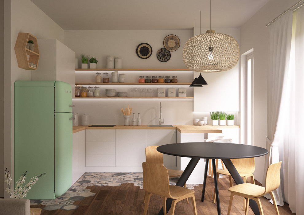 Design ideas for a mid-sized scandinavian l-shaped eat-in kitchen in Other with a drop-in sink, flat-panel cabinets, white cabinets, wood benchtops, white splashback, matchstick tile splashback, stainless steel appliances, light hardwood floors, a peninsula, brown floor and brown benchtop.