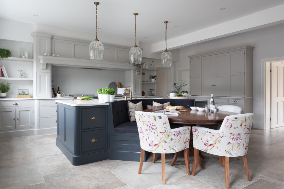 Photo of a large transitional l-shaped eat-in kitchen in Other with an undermount sink, recessed-panel cabinets, grey cabinets, grey splashback, with island, grey floor and white benchtop.