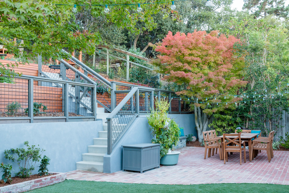 Design ideas for a large country backyard xeriscape in San Francisco with a retaining wall.