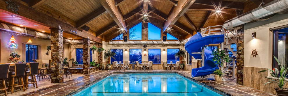 Inspiration for a mid-sized rustic indoor stone and rectangular indoor pool house remodel