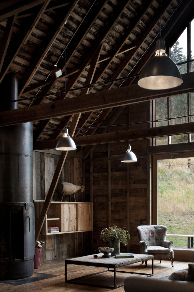 Inspiration for a country living room in Seattle with a metal fireplace surround.