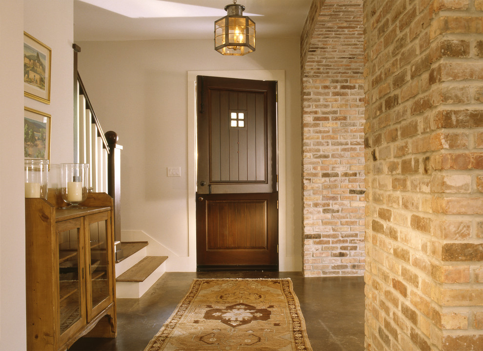 Photo of a traditional entryway in Houston with a dutch front door.