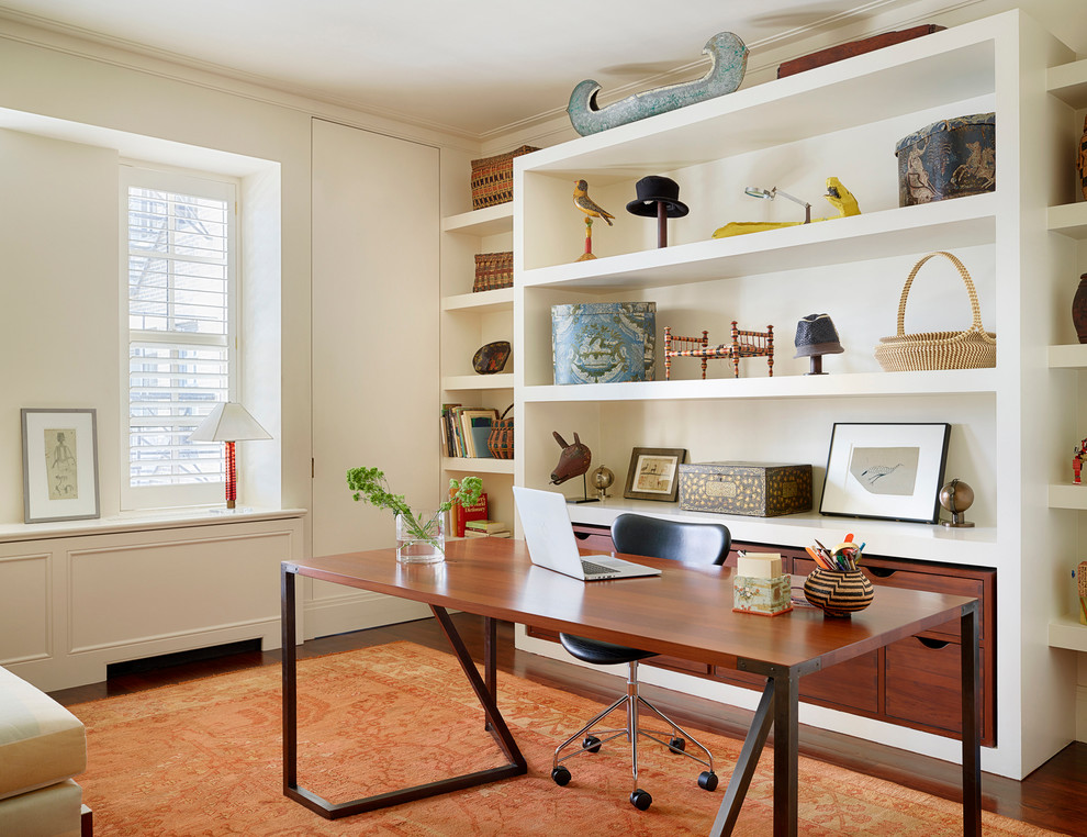 Asian study room in Chicago with white walls, a freestanding desk and dark hardwood floors.