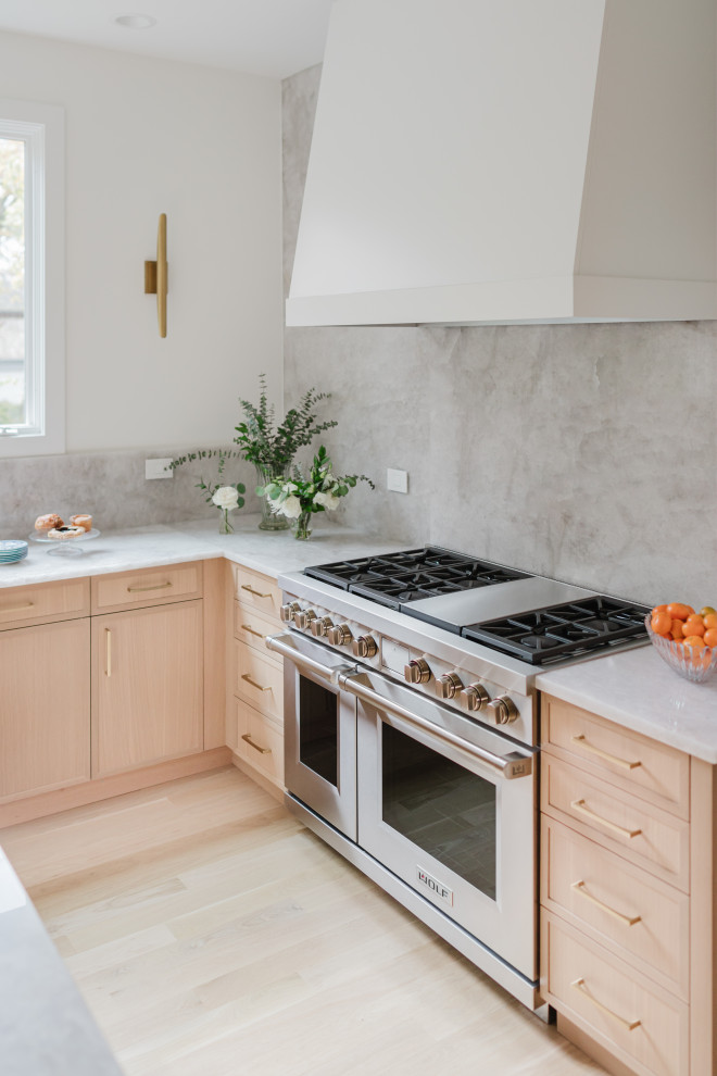 Modern Kitchen Interior with Marble Backsplash and Stainless Steel Appliances