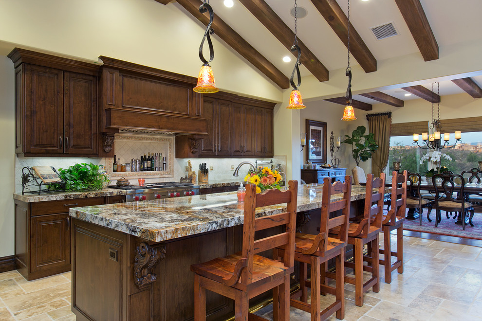 Traditional open plan kitchen in San Diego with an undermount sink, granite benchtops and stainless steel appliances.