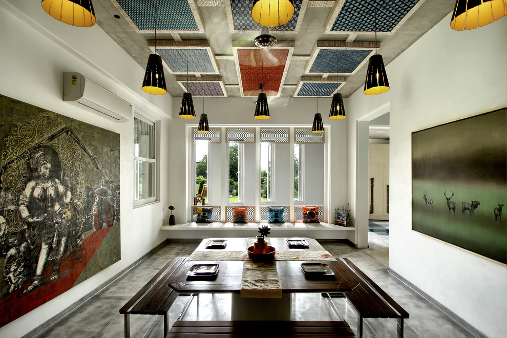 Design ideas for a large eclectic open plan dining in Ahmedabad with white walls.