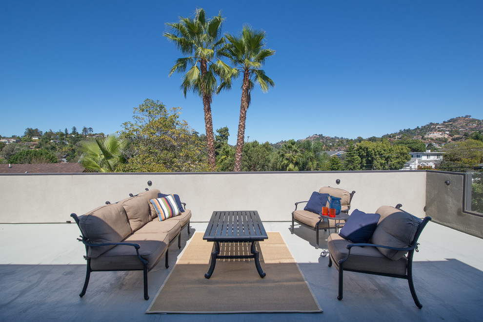 Example of a huge trendy rooftop deck design in San Diego