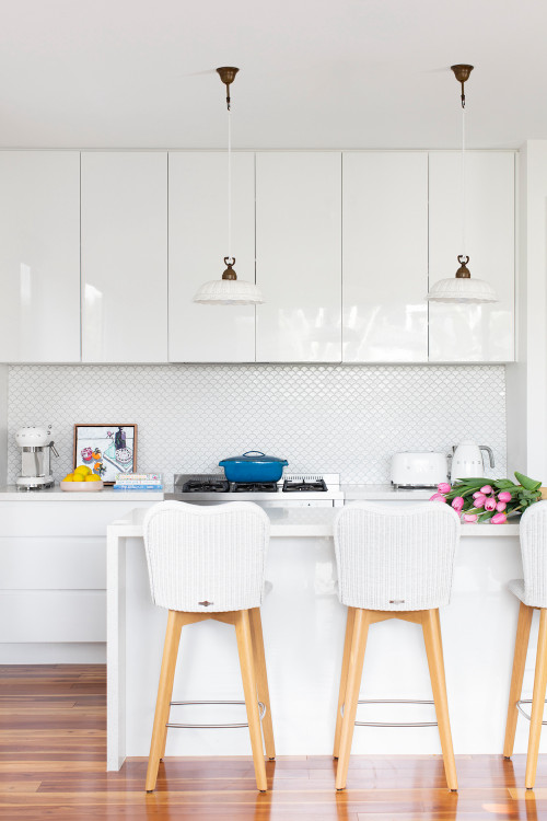 Coastal Comfort: Beach-Style White Kitchen Island Ideas with Mermaid Tile Backsplash and Gloss Cabinets