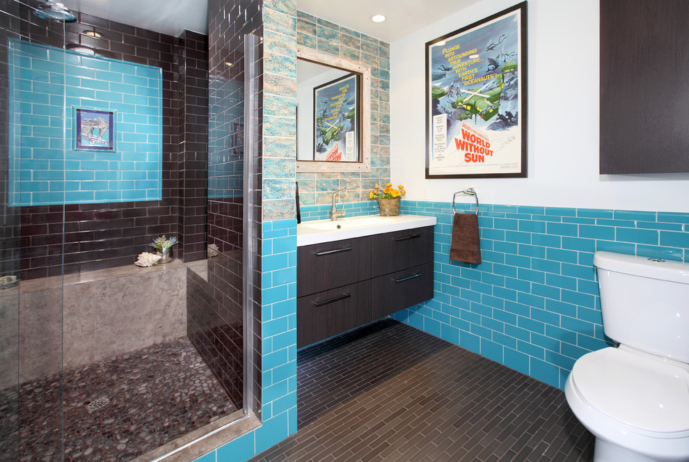 Photo of an eclectic bathroom in Los Angeles with an integrated sink and subway tile.