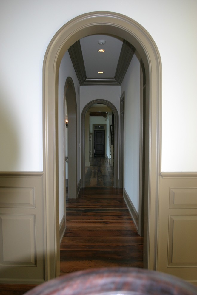 Expansive traditional hallway in Other with white walls.