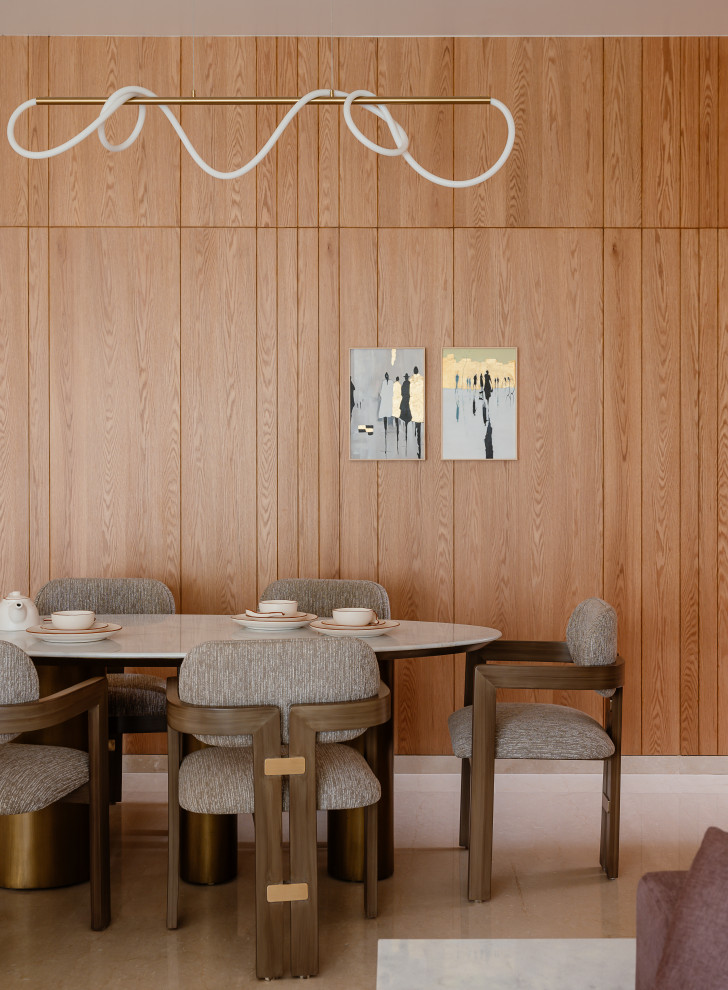 This is an example of a contemporary dining room in Other with beige floor and wood walls.