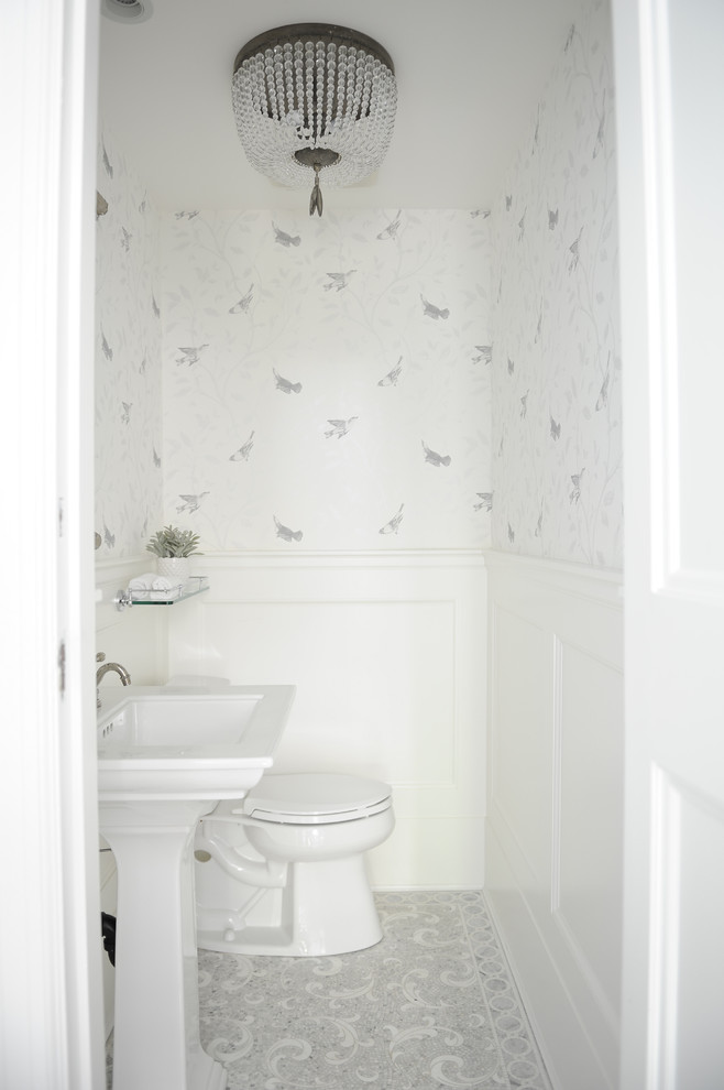Inspiration for a small traditional powder room in Vancouver with white tile, mosaic tile, white walls, marble floors and a pedestal sink.