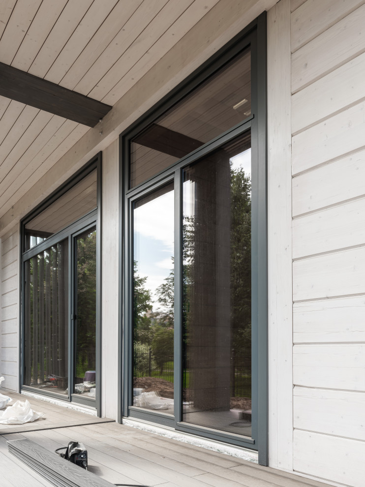 Трапецевидные окна, порталы и входные двери для современного дома