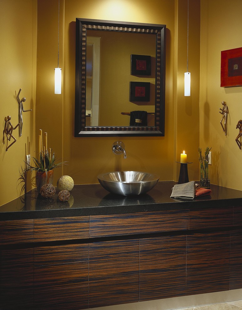 This is an example of a contemporary powder room in Phoenix with a vessel sink, flat-panel cabinets, dark wood cabinets and granite benchtops.