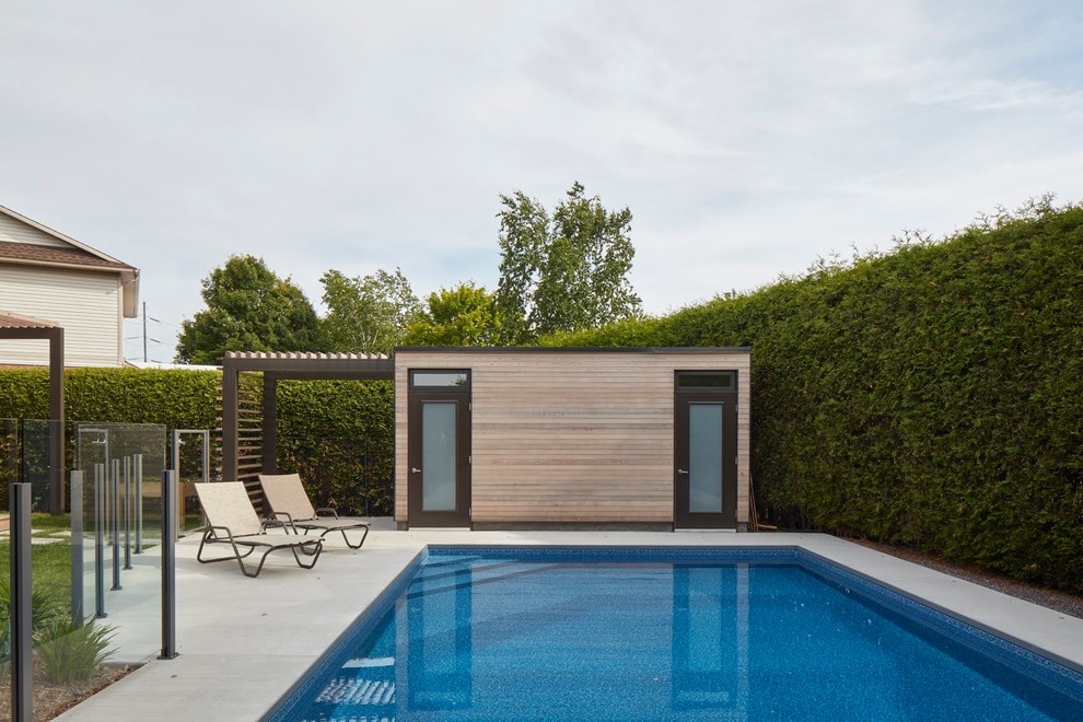 Pool - large transitional backyard rectangular lap pool idea in Ottawa