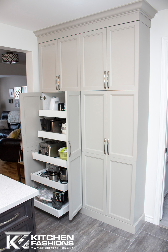 Example of a mid-sized transitional single-wall ceramic tile open concept kitchen design with an undermount sink, shaker cabinets, gray cabinets, solid surface countertops, gray backsplash, mosaic tile backsplash, white appliances and an island