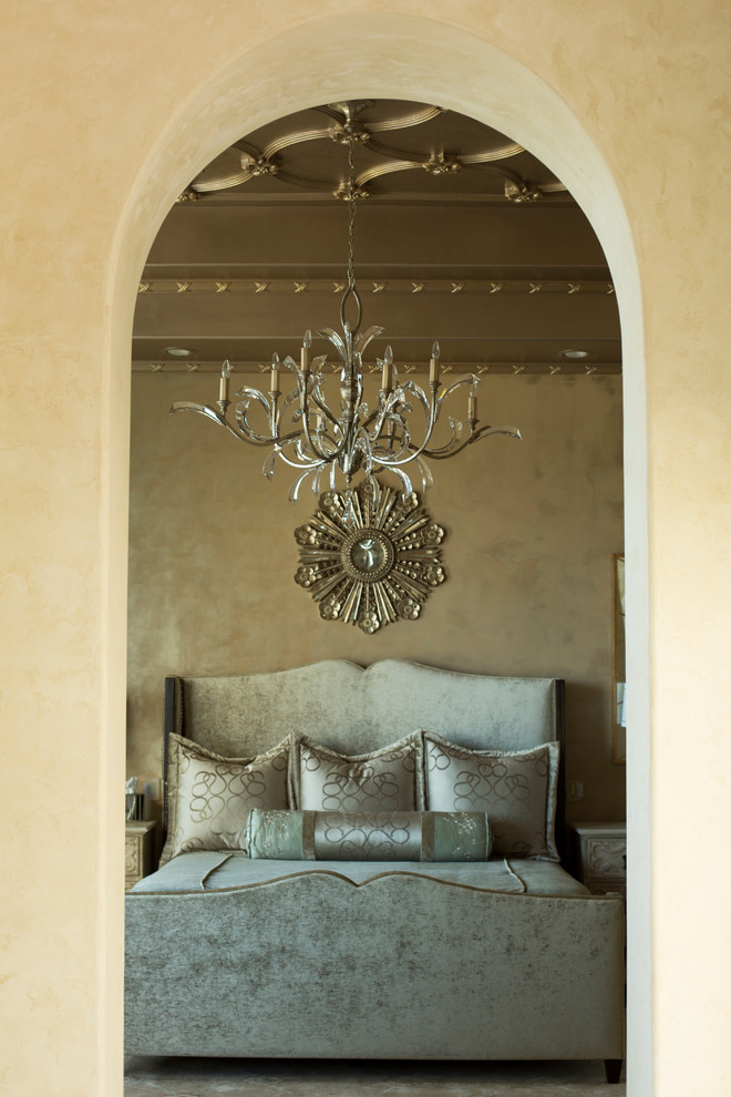 Large mediterranean guest bedroom in Houston with beige walls.