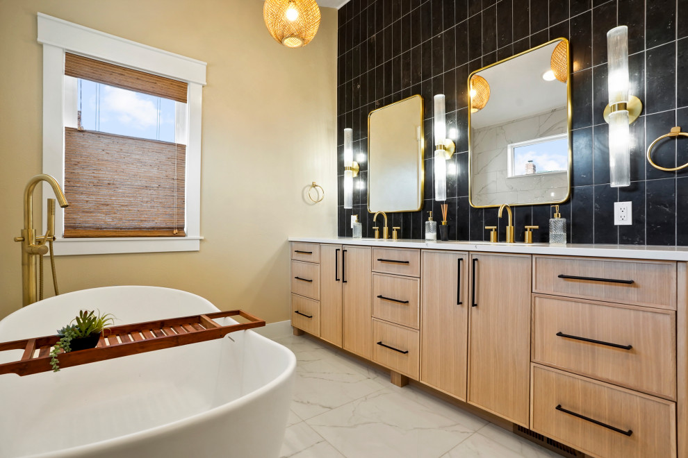 This is an example of a large contemporary ensuite bathroom with recessed-panel cabinets, light wood cabinets, a japanese bath, an alcove shower, black tiles, ceramic tiles, beige walls, a submerged sink, a hinged door, white worktops, double sinks and a built in vanity unit.