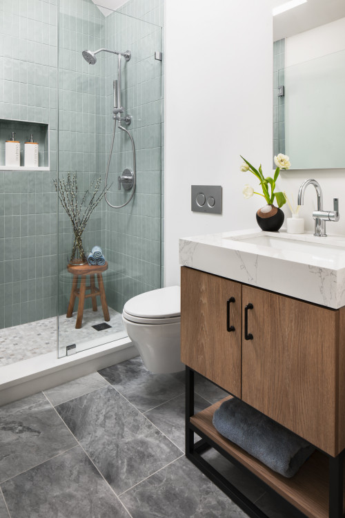 Modern wood guest bathrooms cabinets with marble countertop and glass shower design
