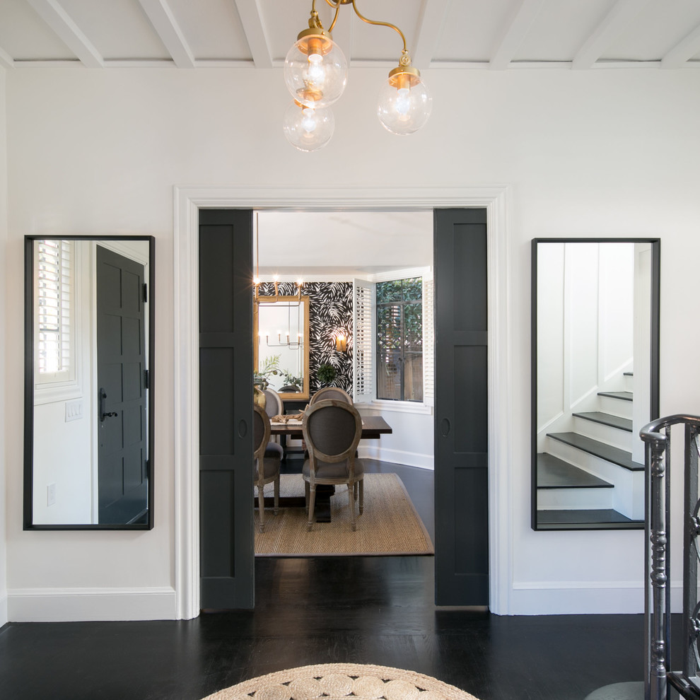 Mid-sized contemporary foyer in San Francisco with white walls, dark hardwood floors, a single front door, a black front door and black floor.