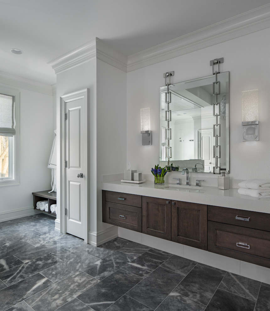 Photo of a large transitional master bathroom in Detroit with recessed-panel cabinets, dark wood cabinets, a freestanding tub, a double shower, a drop-in sink, black and white tile, gray tile, white walls, marble floors and quartzite benchtops.