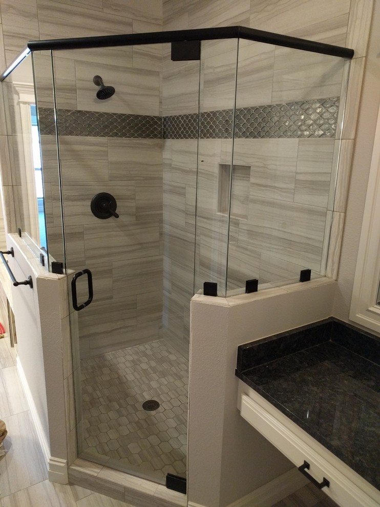Bathroom - transitional bathroom idea with a hinged shower door
