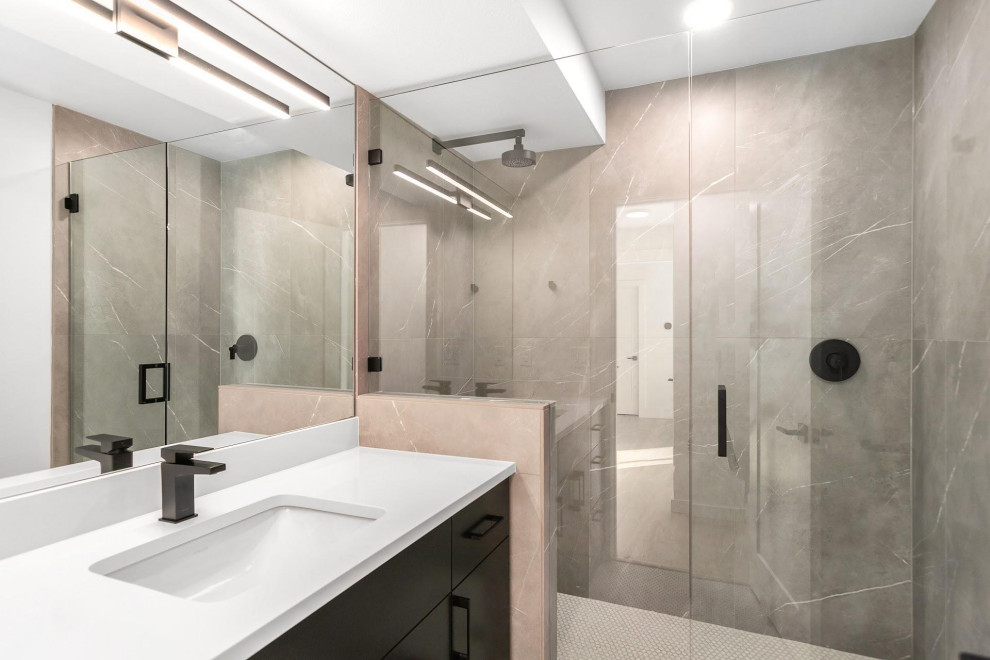 Modern bathroom in Portland with flat-panel cabinets, black cabinets, gray tile, porcelain tile, porcelain floors, an undermount sink, granite benchtops, white floor, a hinged shower door, white benchtops, an enclosed toilet, a single vanity and a floating vanity.