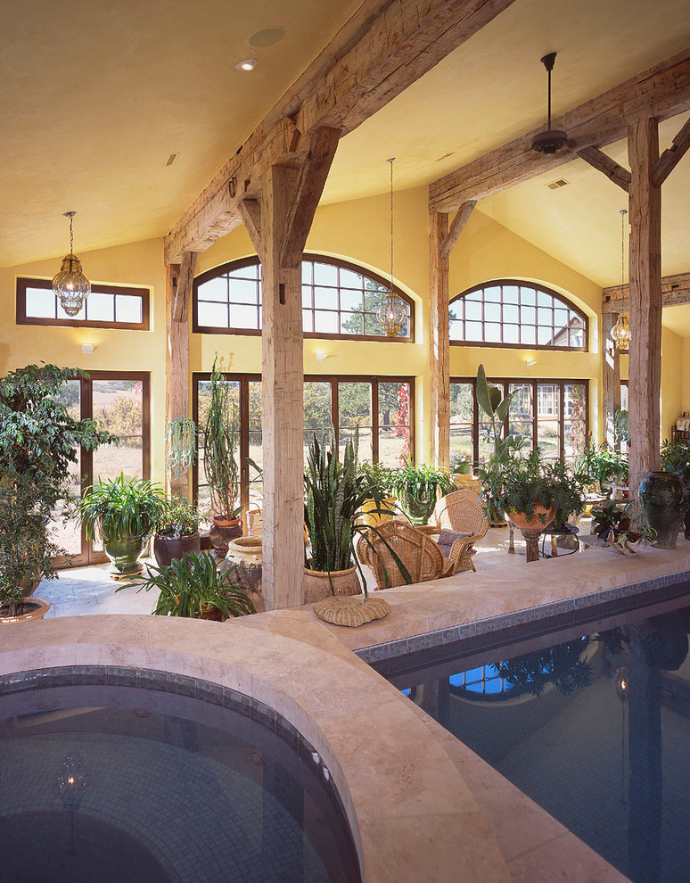 This is an example of a mediterranean indoor pool in Denver with a pool house.