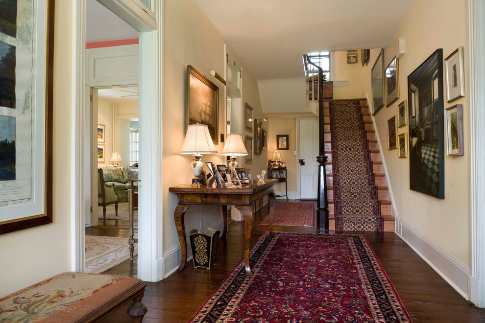 Photo of a traditional foyer in Philadelphia with beige walls and dark hardwood floors.