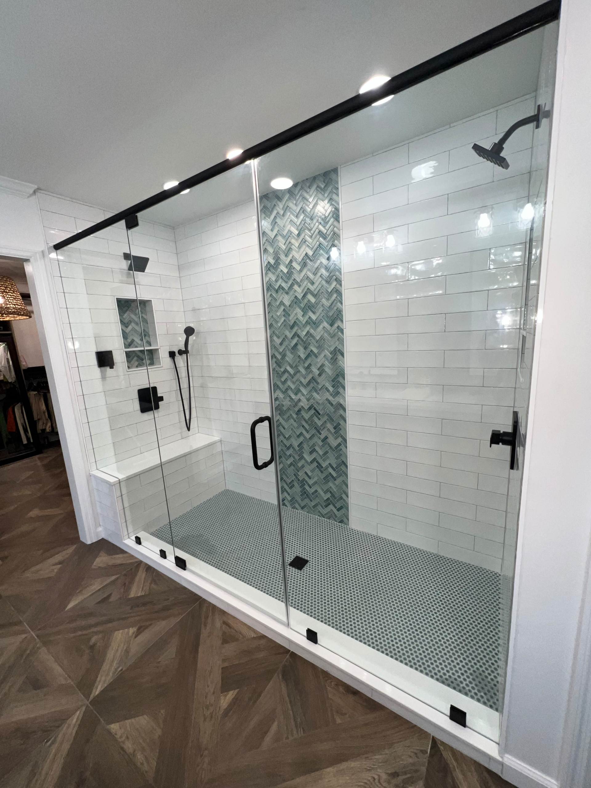 Walk in shower with custom stained vanity