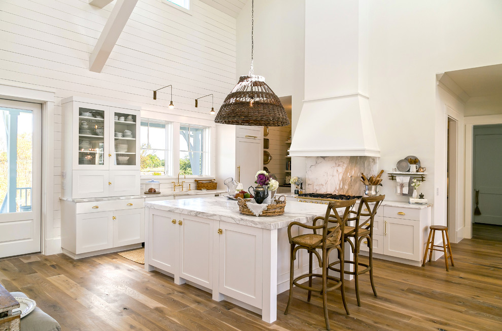 Example of a transitional kitchen design in Charleston with shaker cabinets and white cabinets
