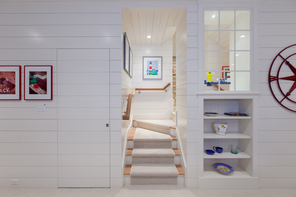 Mid-sized beach style wood staircase in Boston with painted wood risers.