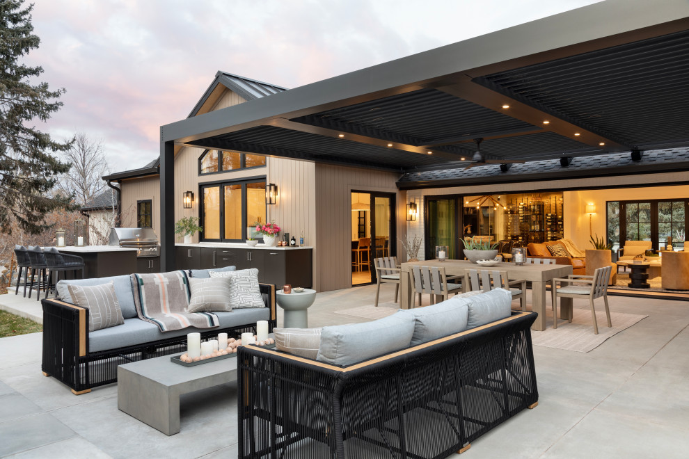 Inspiration for a large transitional backyard patio in Denver with an outdoor kitchen and a pergola.