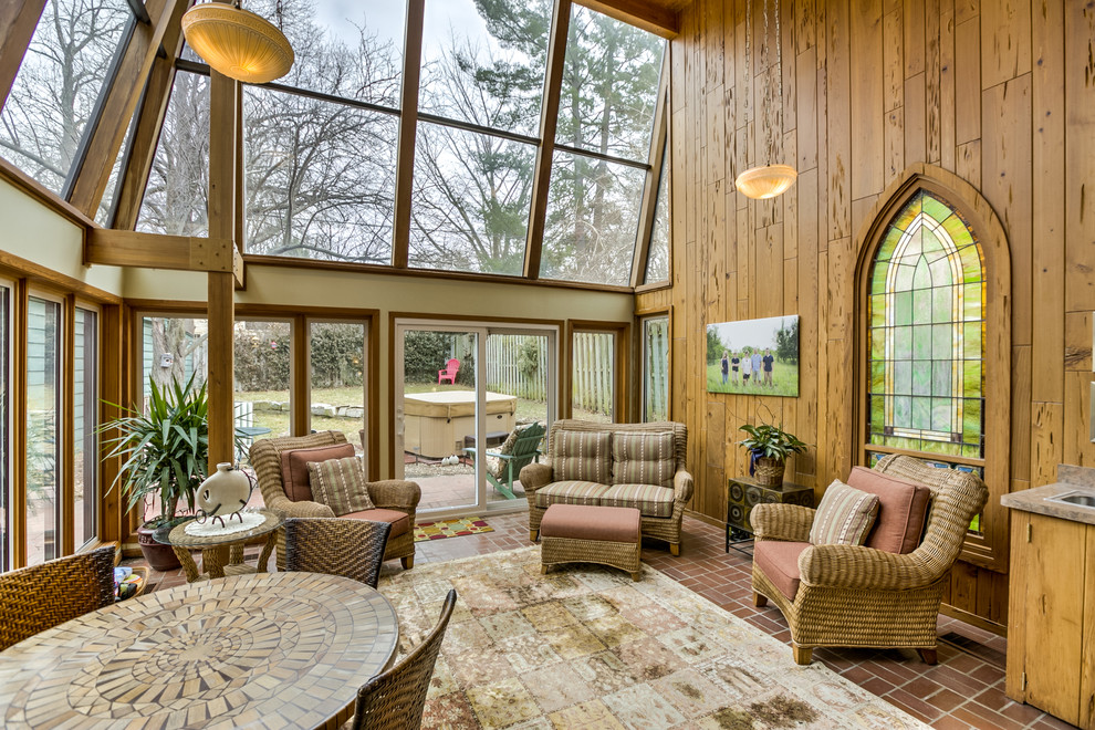 Inspiration for a traditional sunroom in Omaha with brick floors, no fireplace and a standard ceiling.