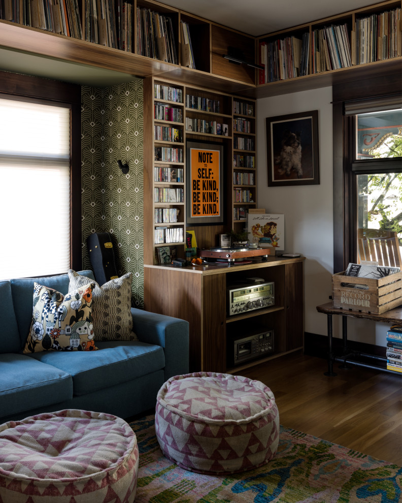 Family room - eclectic enclosed medium tone wood floor and brown floor family room idea in Seattle with a music area, white walls, no fireplace and no tv