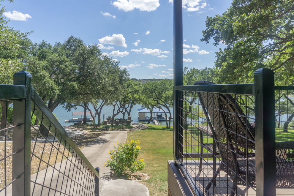 Inspiration for a large rustic backyard balcony deck remodel in Austin