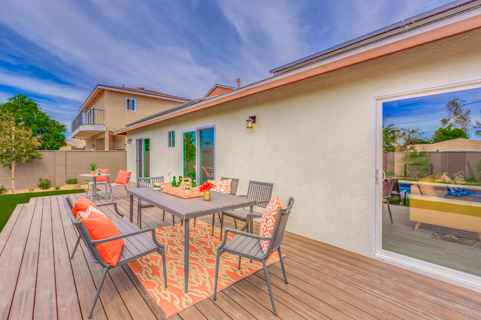 Inspiration for a large transitional backyard concrete and rectangular lap hot tub remodel in Orange County